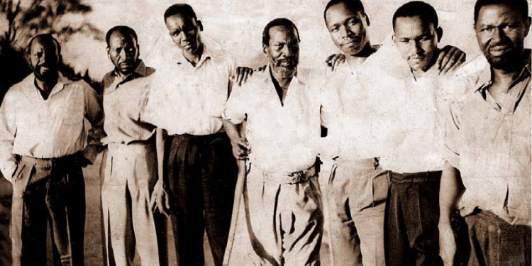 The Kapenguria Six who were seized and jailed at Kapenguria when a State of Emergency was declared on the night of October 20, 1952, pose for a picture with Kadu leader Daniel arap Moi (third right) when he visited them. They are (from left) Bildad Kaggia, Kung’u Karumba, Achieng’ Oneko, Jomo Kenyatta, Paul Ngei and Fred Kubai.