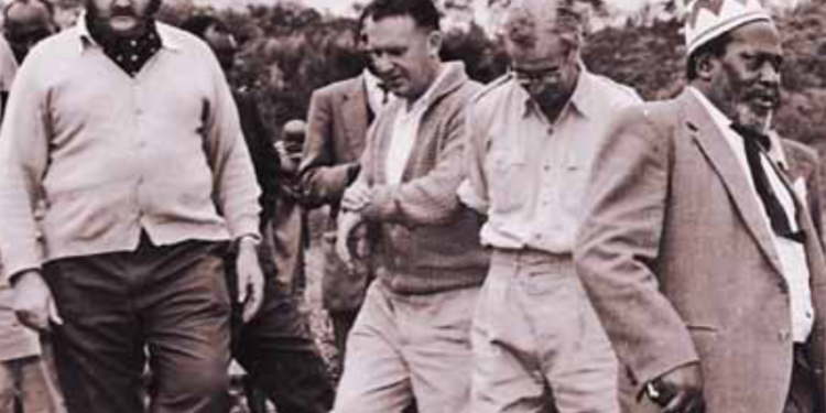 The pre-Madaraka Minister of State for Constitutional Affairs and Economic Planning, Mr. Jomo Kenyatta (right), the Minister for Lands and Settlement, Mr Bruce R. Mckenzie (left) and some White Settlers during a tour of the Wanjohi –Kipipiri High Density Smallholder Scheme in the Rift Valley on October 4,1962.