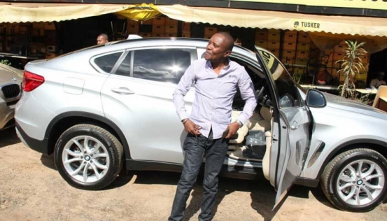 Maina Kageni with car