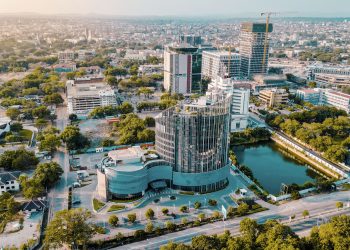 Aerial view of Accra Ghana city skyline with modern buildings and coastal roads
