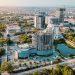 Aerial view of Accra Ghana city skyline with modern buildings and coastal roads