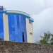 Kisii University Central Administration Building with flags at half-mast mourning Raila Odinga