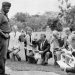 British expatriates kneel before Ugandan President Idi Amin during a citizenship oath ceremony at State House, Entebbe, September 1975.