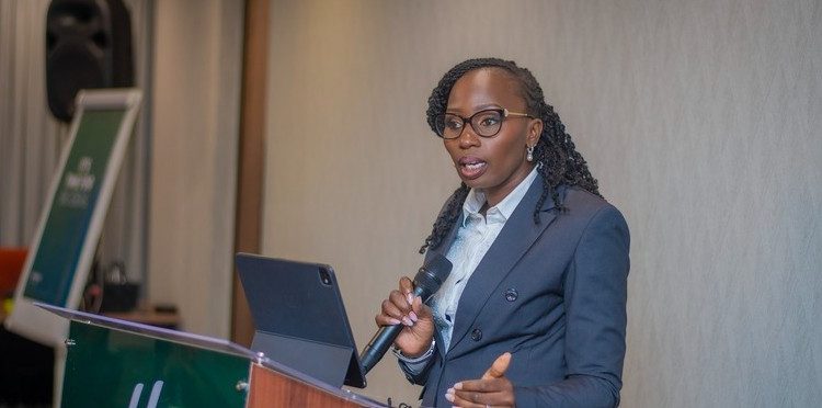 Law Society of Kenya President Faith Odhiambo speaking into a microphone during a professional conference.