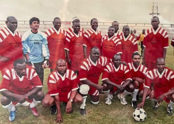 President William Ruto, Raila Odinga, and Other Pentagon Members Posing for a Football Team at Nyayo Stadium (2007)